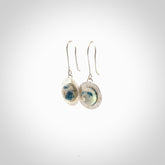 These are a pair of beautiful Aotea Stone and sterling silver earrings. It is carved from Aotea Stone from New Zealand. It is a light blue and white colour with sterling silver. Hand made here in New Zealand by Ana Krakosky.